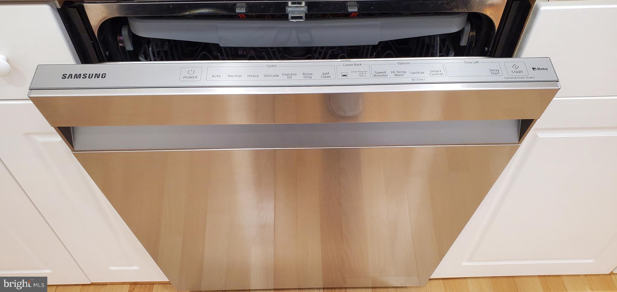 11800 Old Georgetown Road, Unit 1103 Rockville, MD 20852 - Photo 28 of 29 a view of washer dryer with wooden floor