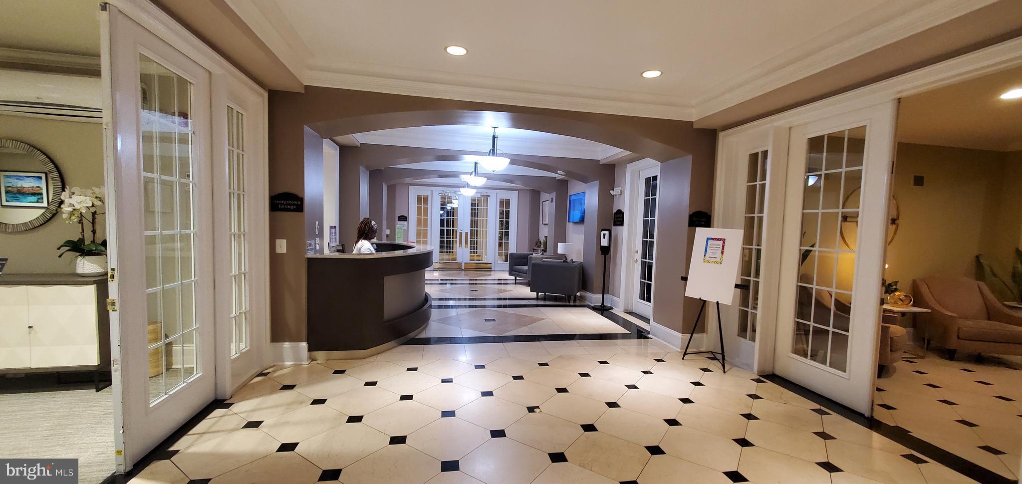 11800 Old Georgetown Road, Unit 1103 Rockville, MD 20852 - Photo 5 of 29 a kitchen with granite countertop a refrigerator and a stove