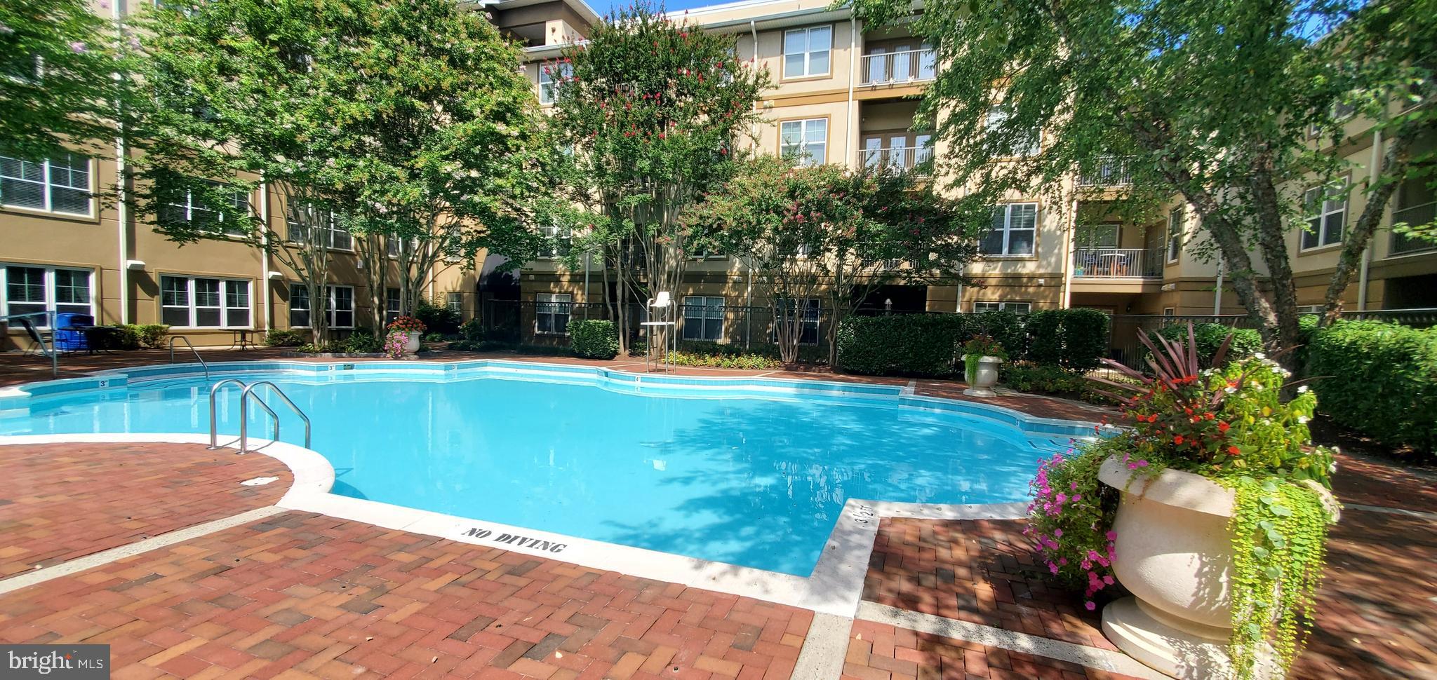 11800 Old Georgetown Road, Unit 1103 Rockville, MD 20852 - Photo 9 of 29 a view of a house with a backyard