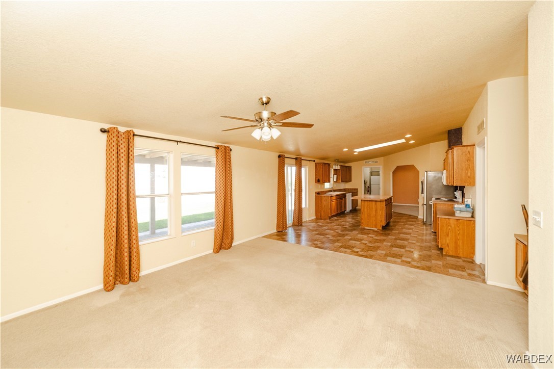 3375 West Rancho Road Golden Valley, AZ 86413 - Photo 14 of 33 a view of a livingroom with a furniture and chandelier fan