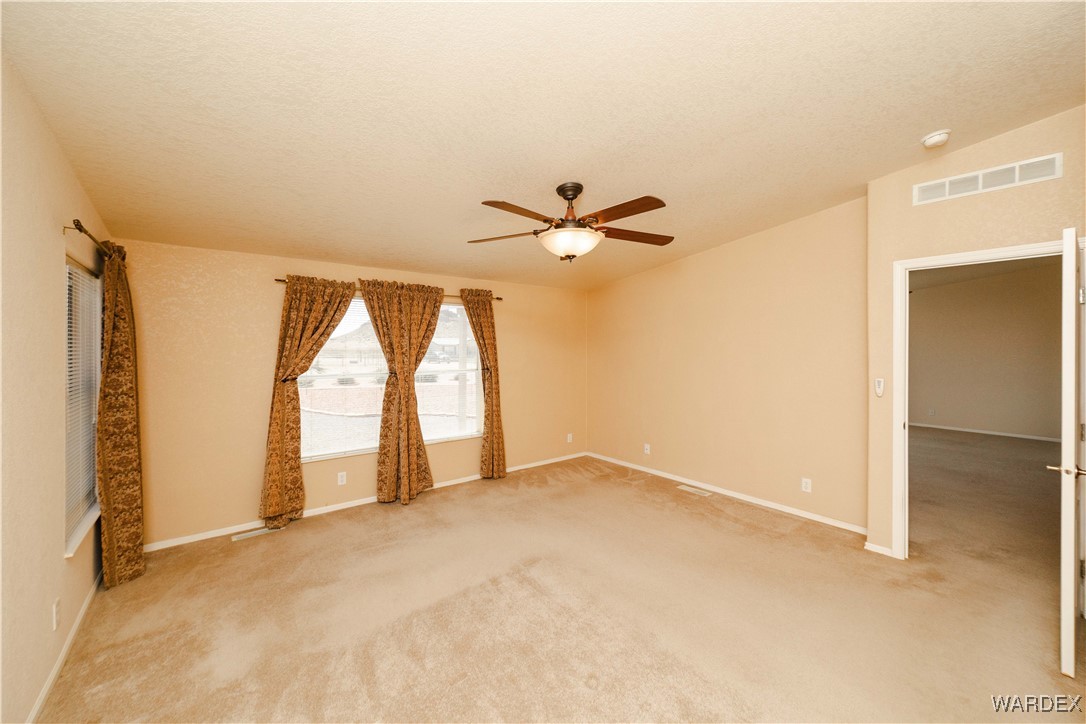 3375 West Rancho Road Golden Valley, AZ 86413 - Photo 19 of 33 a view of an empty room with a window