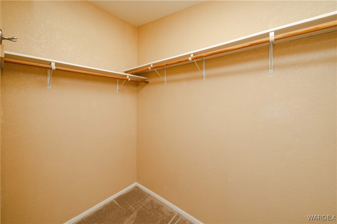 3375 West Rancho Road Golden Valley, AZ 86413 - Photo 20 of 33 a view of a room with racks on the wall
