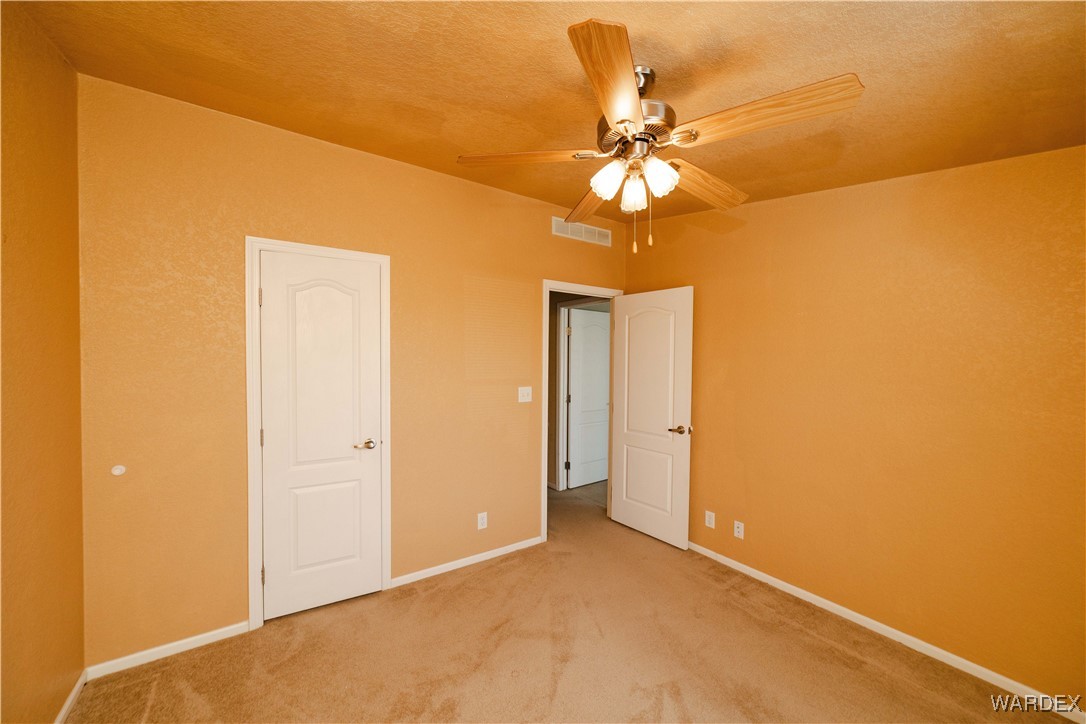 3375 West Rancho Road Golden Valley, AZ 86413 - Photo 26 of 33 a view of a chandelier in a room