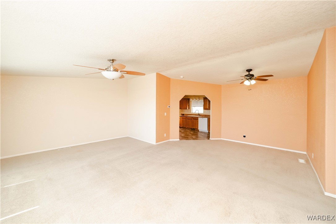 3375 West Rancho Road Golden Valley, AZ 86413 - Photo 5 of 33 a view of a room with cabinet and a fireplace