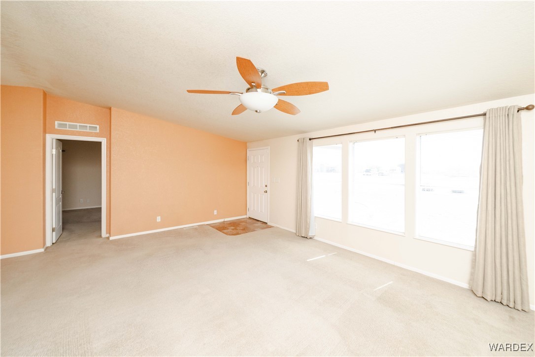 3375 West Rancho Road Golden Valley, AZ 86413 - Photo 6 of 33 a view of an empty room with a window
