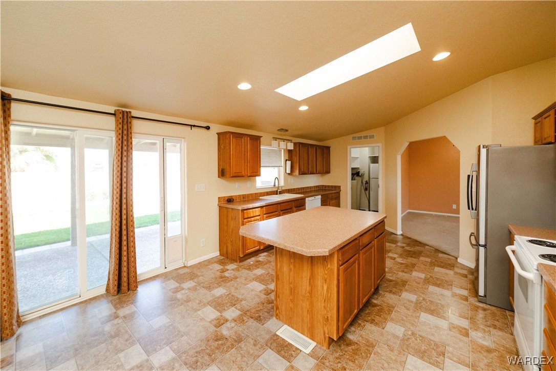 3375 West Rancho Road Golden Valley, AZ 86413 - Photo 10 of 33 a kitchen with a refrigerator a sink and a refrigerator