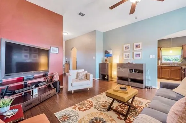 a kitchen with stainless steel appliances granite countertop a refrigerator sink and stove