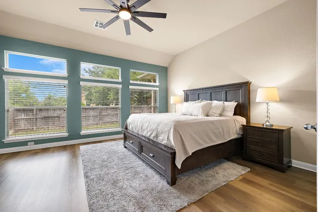 a bedroom with a bed and window