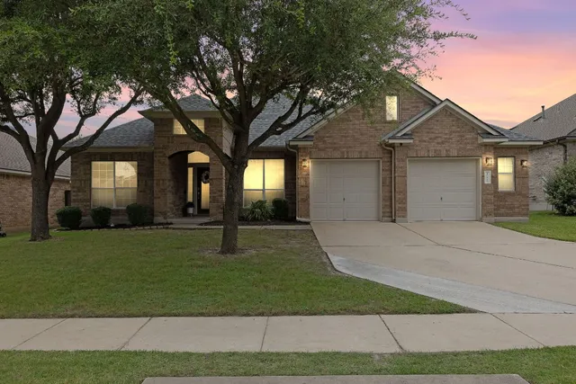 a house view with a garden space