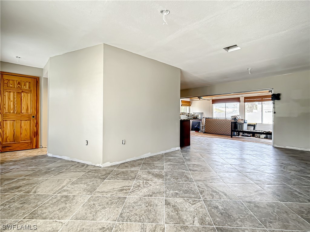 207 Redfish Road Fort Myers Beach, FL 33931 - Photo 14 of 50 a view of livingroom with hardwood floor and a ceiling fan
