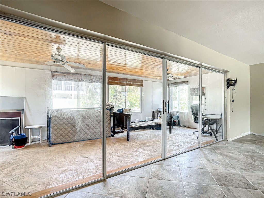 207 Redfish Road Fort Myers Beach, FL 33931 - Photo 15 of 50 a outdoor space with lots of furniture and windows