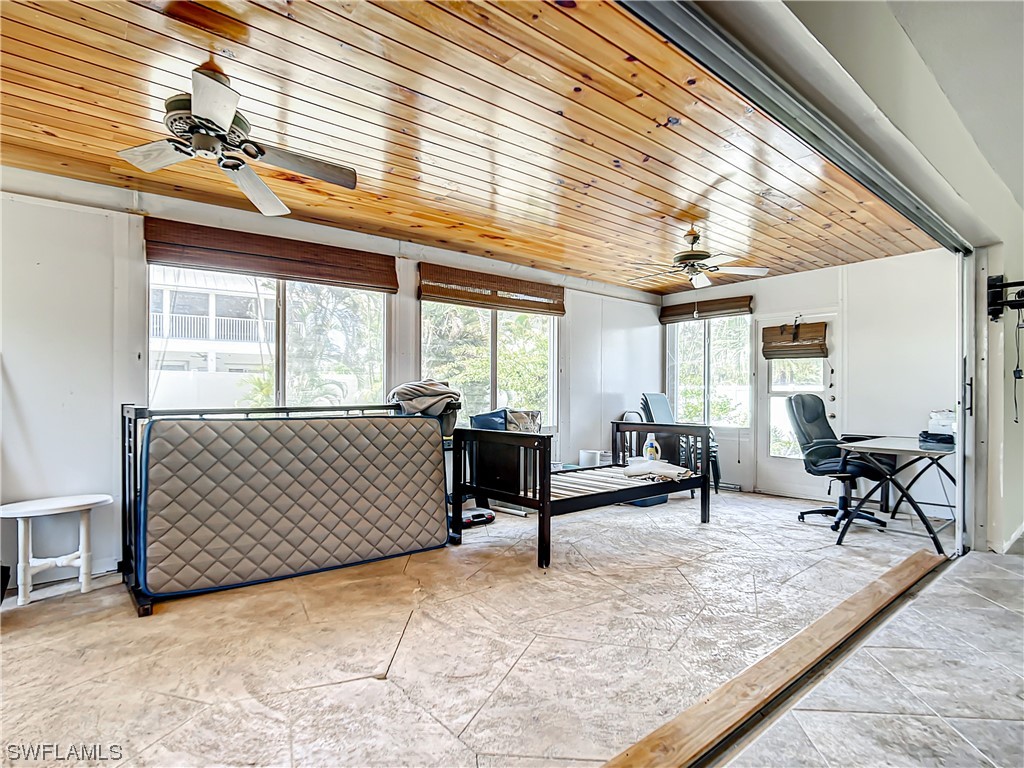 207 Redfish Road Fort Myers Beach, FL 33931 - Photo 16 of 50 a living room with furniture and a window