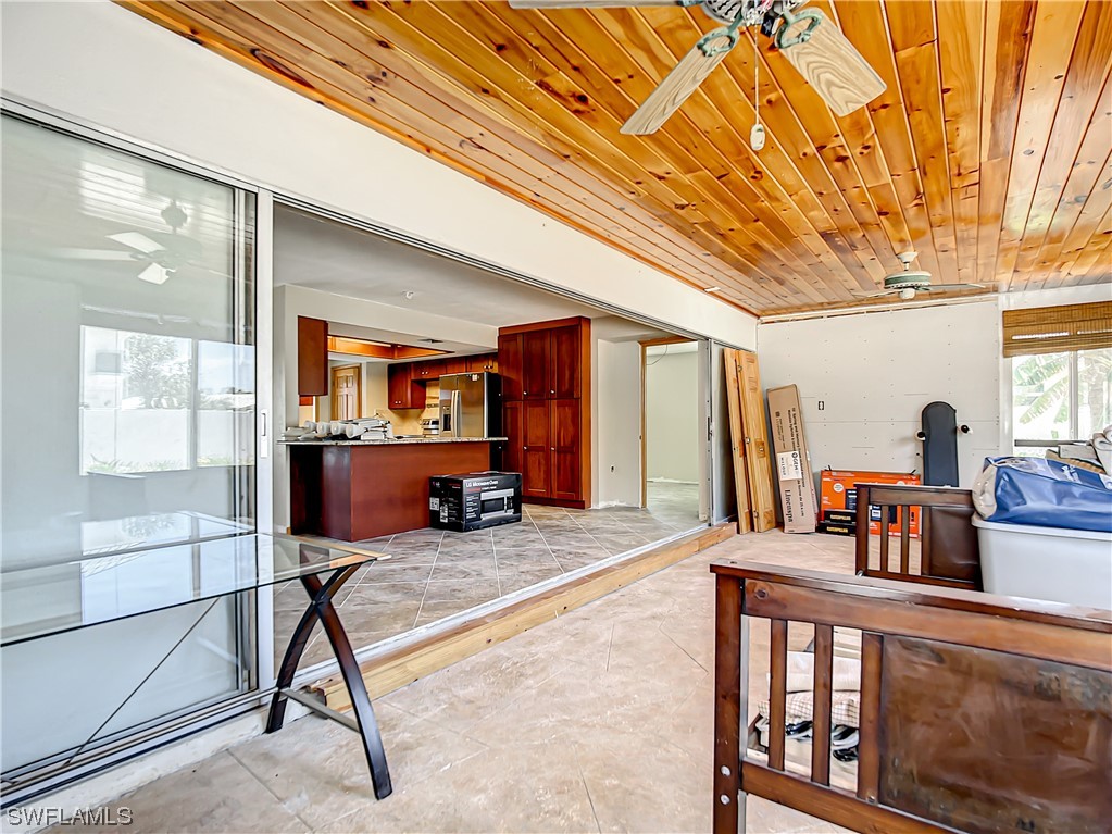 207 Redfish Road Fort Myers Beach, FL 33931 - Photo 17 of 50 a bedroom with furniture and a window