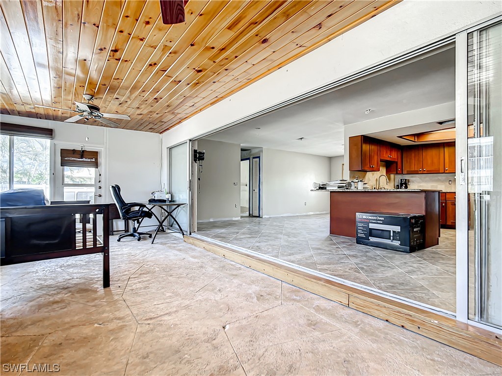 207 Redfish Road Fort Myers Beach, FL 33931 - Photo 19 of 50 a view of a hall way with furniture
