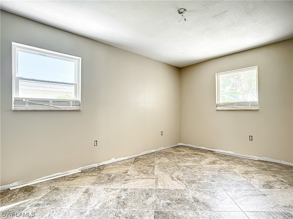 207 Redfish Road Fort Myers Beach, FL 33931 - Photo 22 of 50 a view of a room that has a window in it