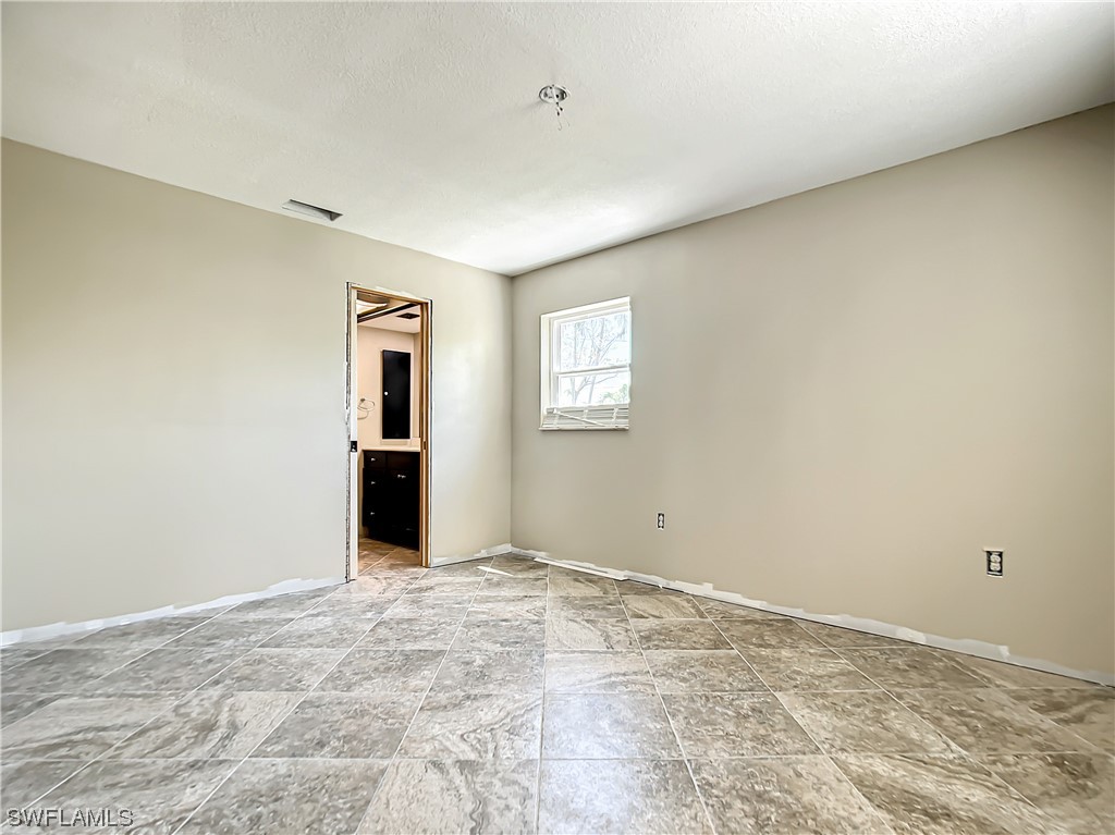 207 Redfish Road Fort Myers Beach, FL 33931 - Photo 23 of 50 a view of an empty room with window and closet area
