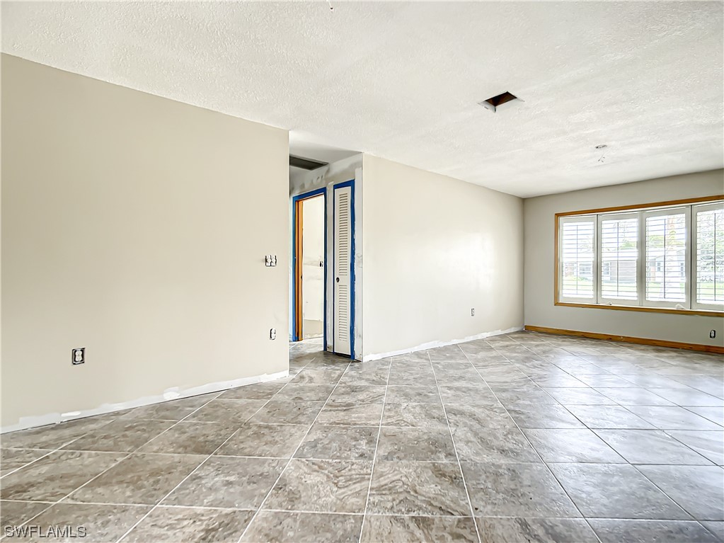 207 Redfish Road Fort Myers Beach, FL 33931 - Photo 28 of 50 a view of an empty room with a window