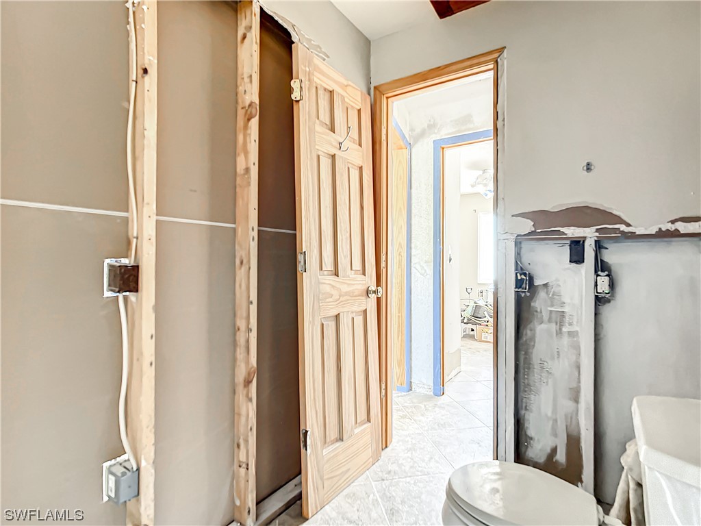 207 Redfish Road Fort Myers Beach, FL 33931 - Photo 32 of 50 a bathroom with a toilet and shower