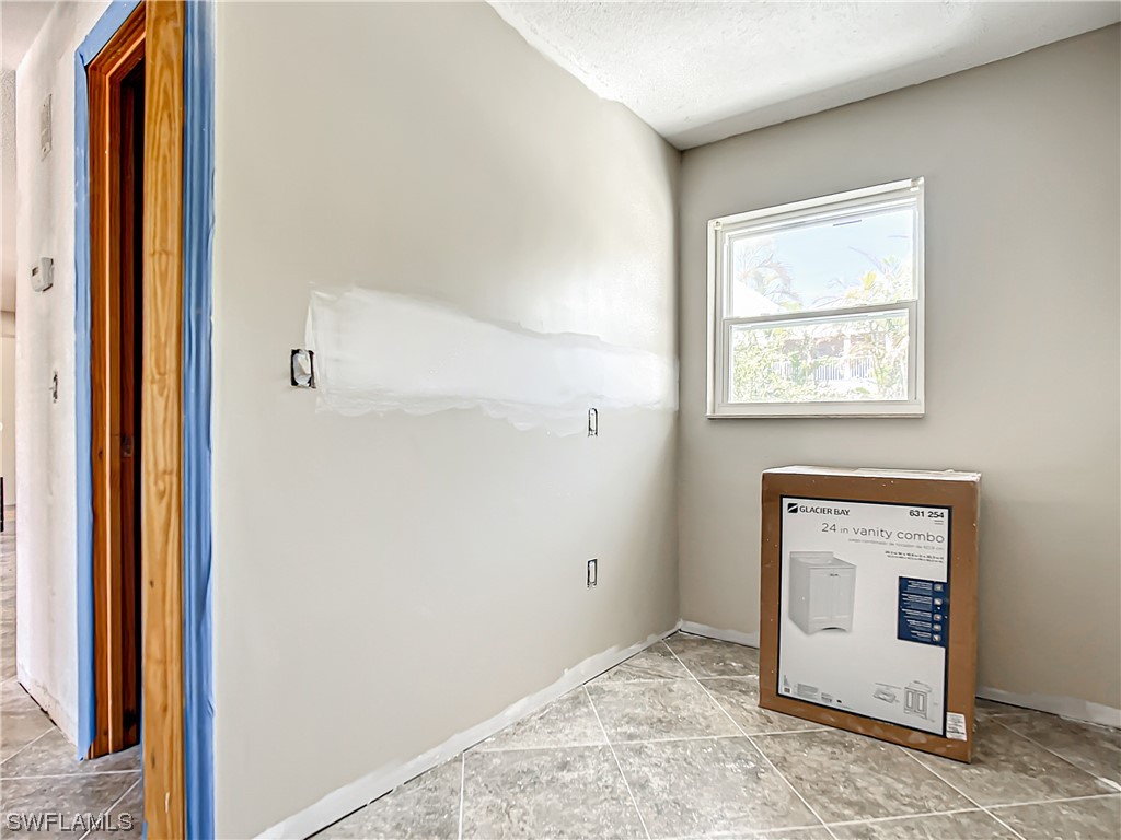 207 Redfish Road Fort Myers Beach, FL 33931 - Photo 34 of 50 an empty room with windows and closet