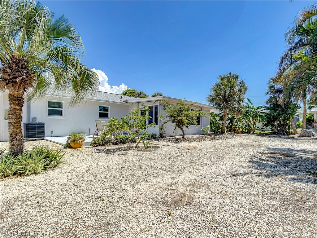 207 Redfish Road Fort Myers Beach, FL 33931 - Photo 41 of 50 a view of a house with a patio