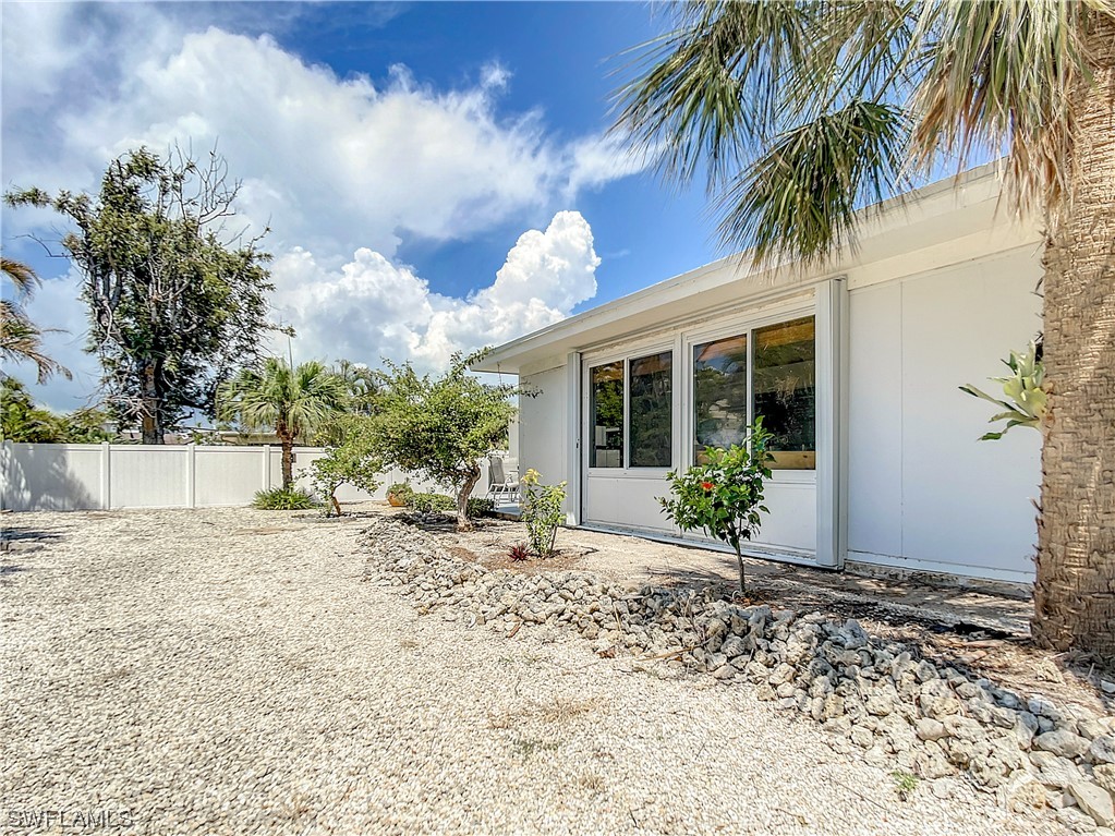 207 Redfish Road Fort Myers Beach, FL 33931 - Photo 42 of 50 a view of a house with a patio