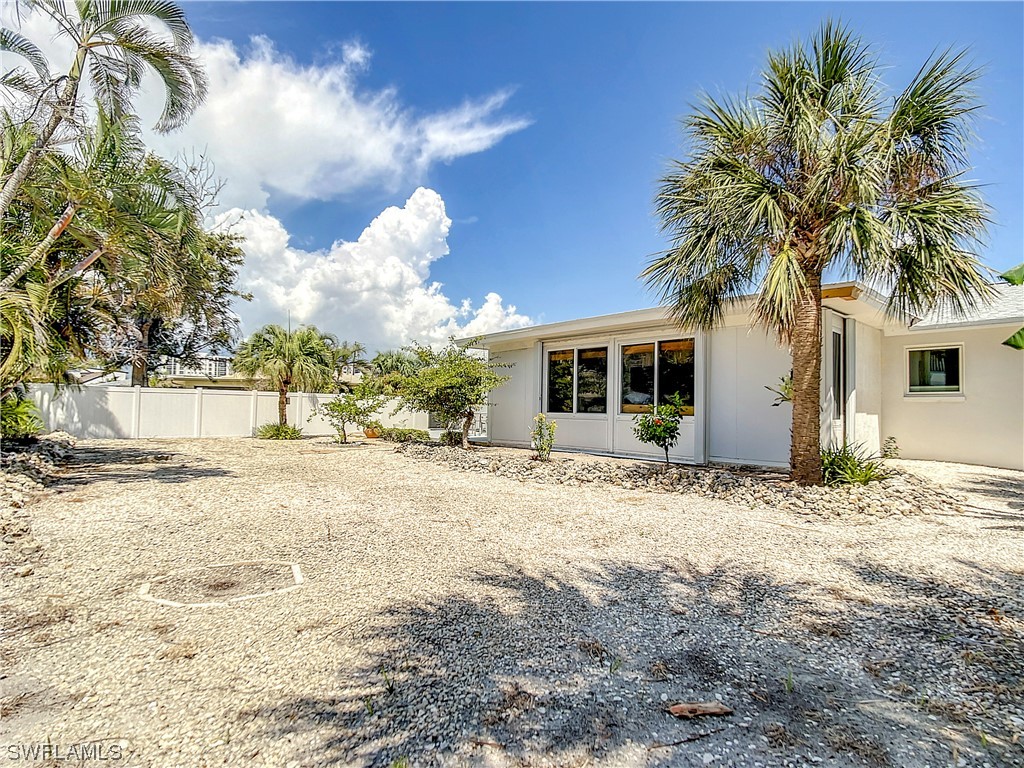207 Redfish Road Fort Myers Beach, FL 33931 - Photo 44 of 50 a view of a house with a patio