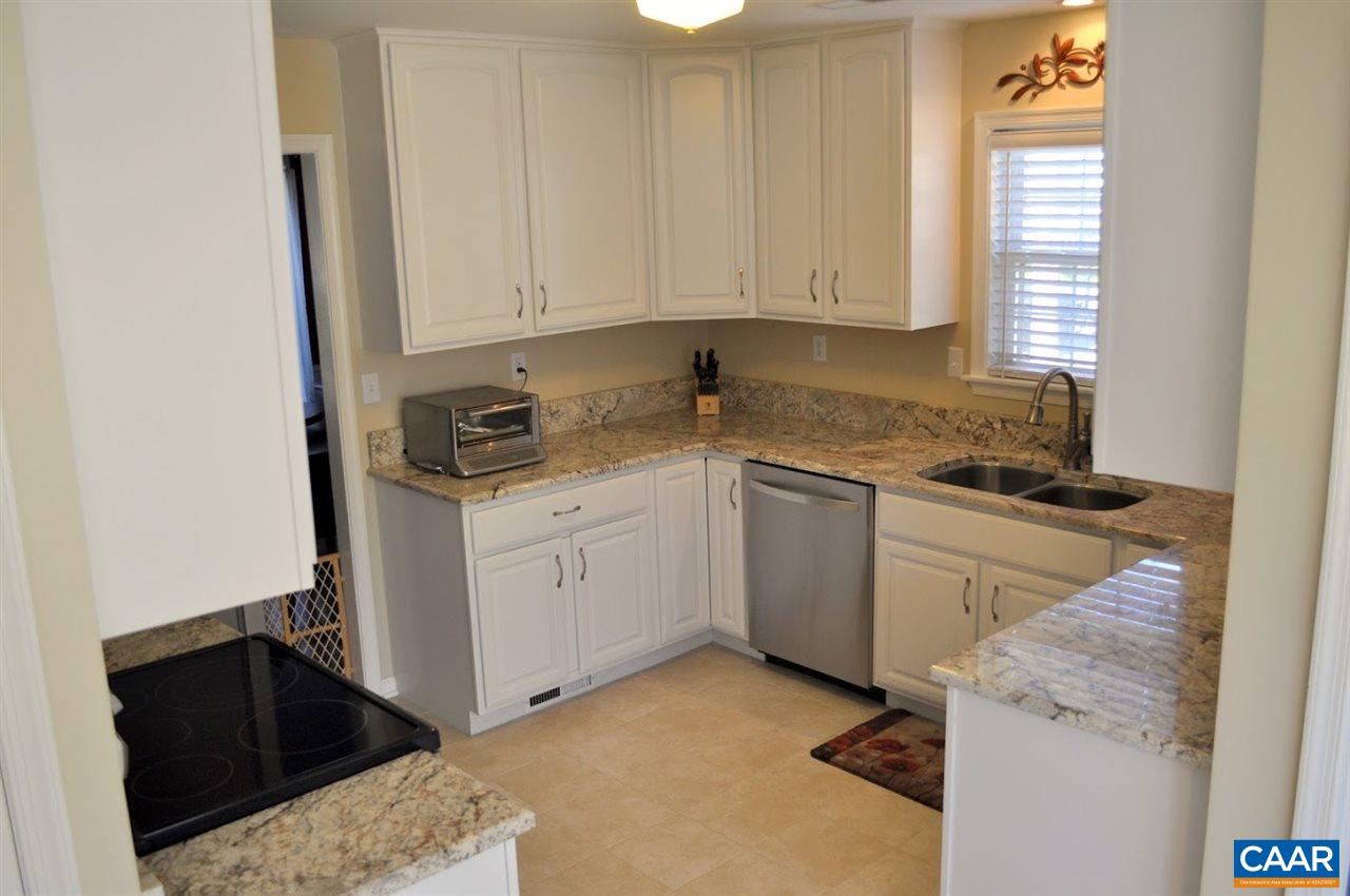 840 Harris Road Charlottesville, VA 22902 - Photo 5 of 11 a kitchen with a sink stove and cabinets