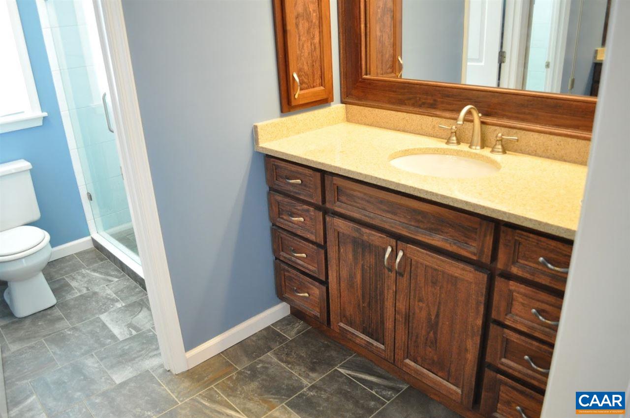 840 Harris Road Charlottesville, VA 22902 - Photo 6 of 11 a bathroom with a sink a toilet and a mirror