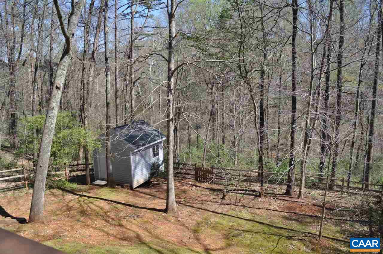 840 Harris Road Charlottesville, VA 22902 - Photo 9 of 11 a backyard of a building with lots of trees