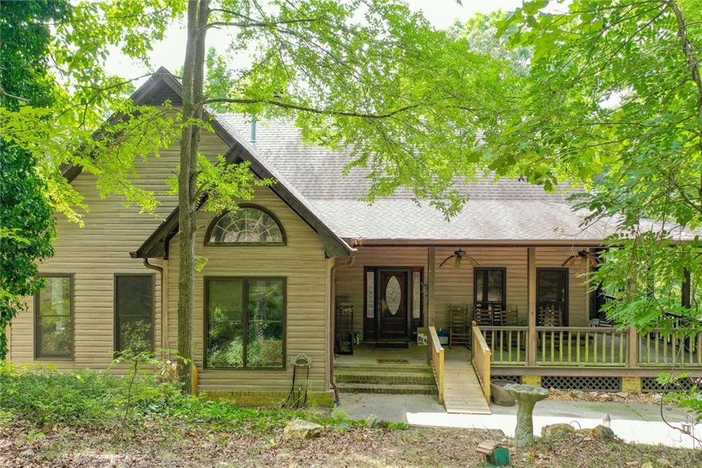 141 Fire Tower Road Northeast Rome, GA 30161 - Photo 1 of 1 a front view of a house with a garden