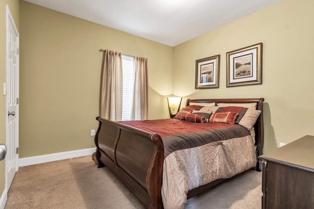 14 Tedesco Road Methuen, MA 01844 - Photo 19 of 40 a bed sitting in a bedroom next to a window