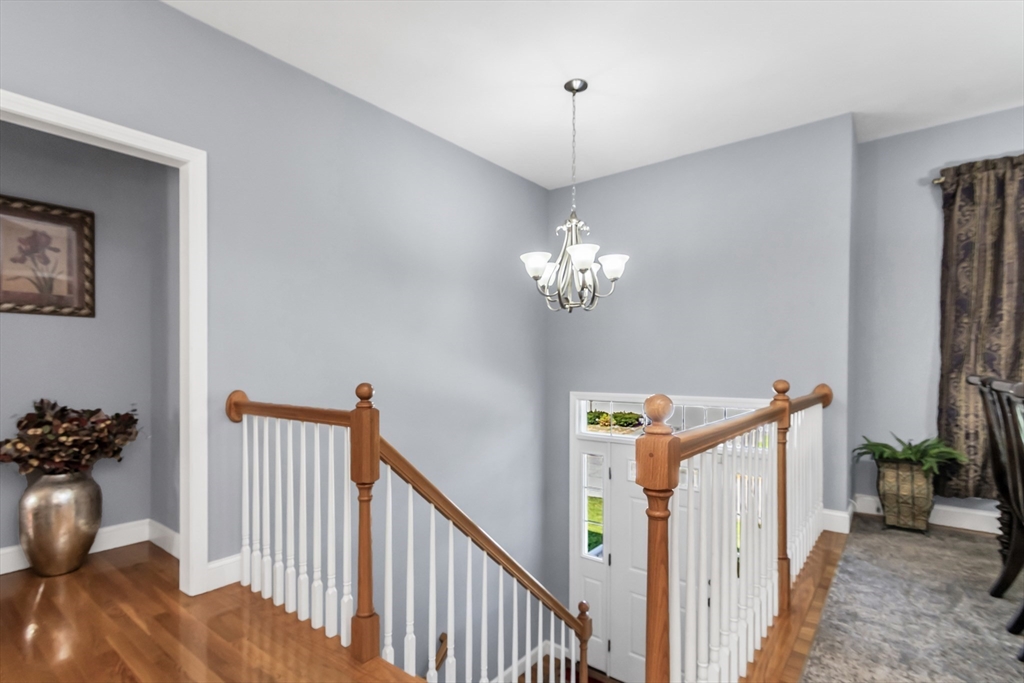 14 Tedesco Road Methuen, MA 01844 - Photo 20 of 40 a view of a livingroom with a furniture wooden floor and chandelier
