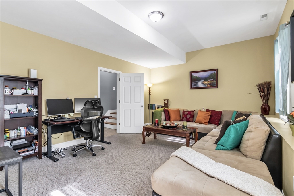 14 Tedesco Road Methuen, MA 01844 - Photo 22 of 40 a living room with furniture and a work place area