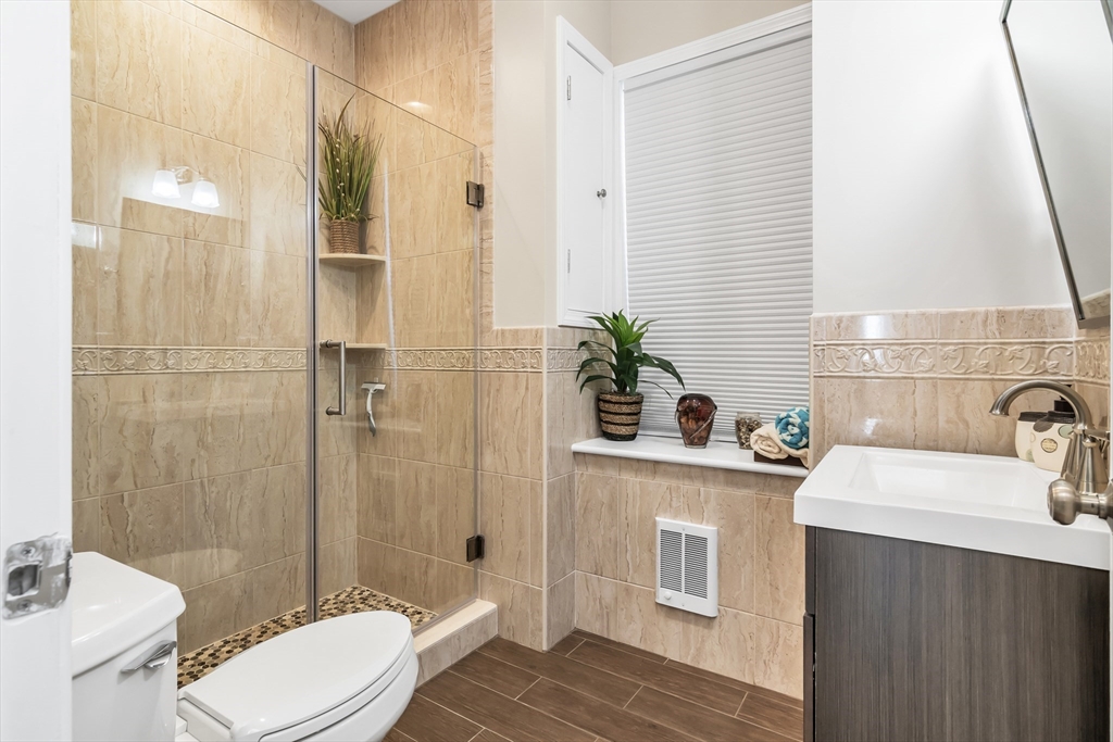 14 Tedesco Road Methuen, MA 01844 - Photo 23 of 40 a bathroom with a sink a toilet and shower