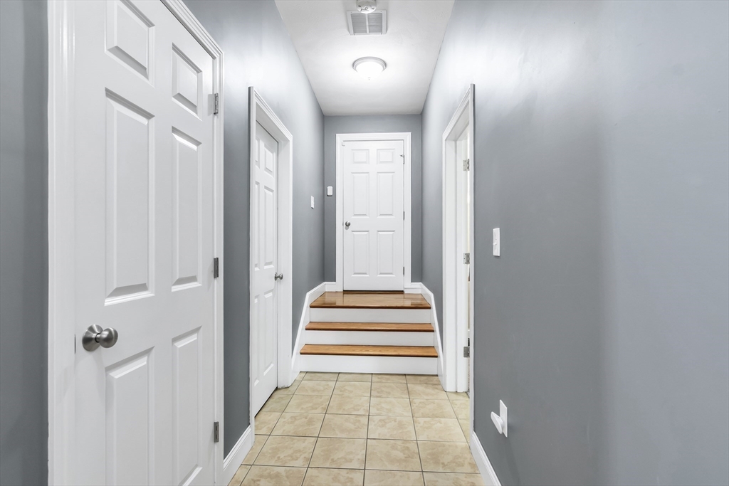 14 Tedesco Road Methuen, MA 01844 - Photo 25 of 40 a view of a hallway with wooden floor and windows