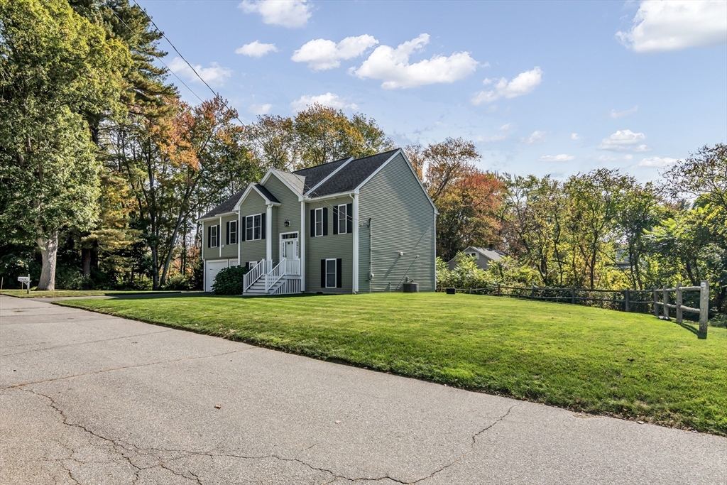 14 Tedesco Road Methuen, MA 01844 - Photo 33 of 40 a front view of a house with a yard and garage