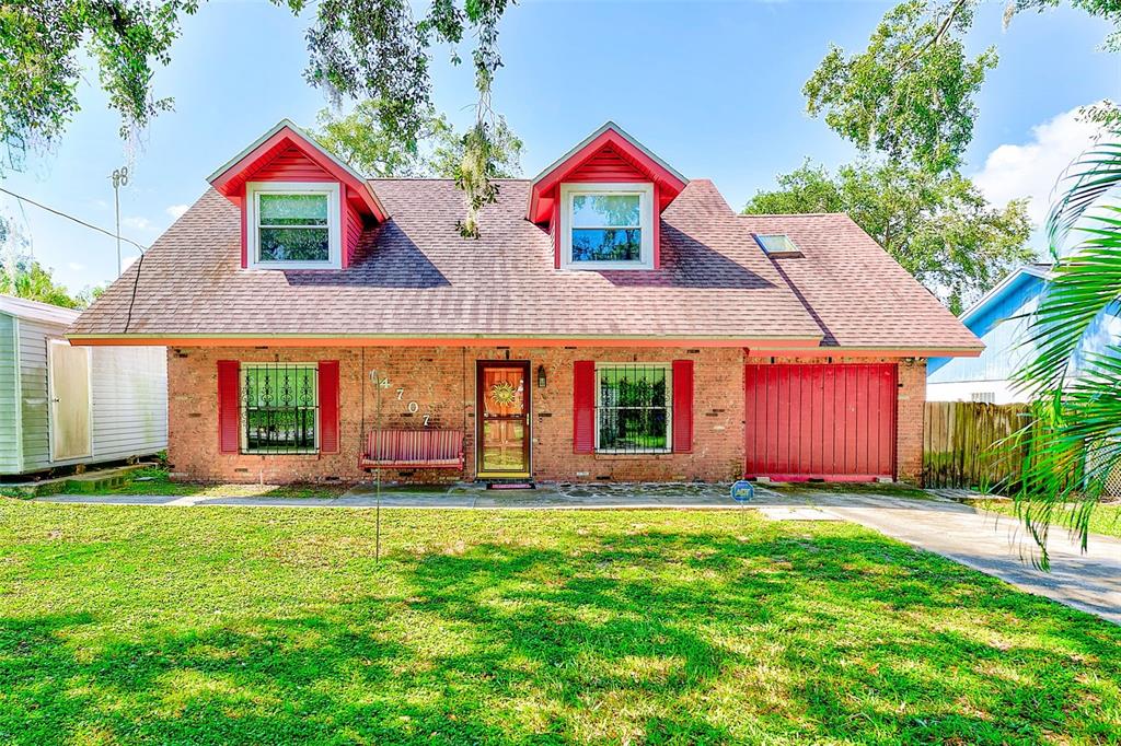 a front view of house with yard and outdoor seating