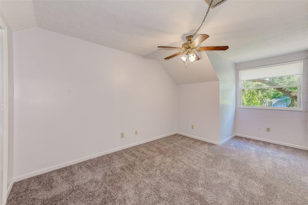 4707 East Temple Heights Road Tampa, FL 33617 - Photo 22 of 54 a view of an empty room with a window