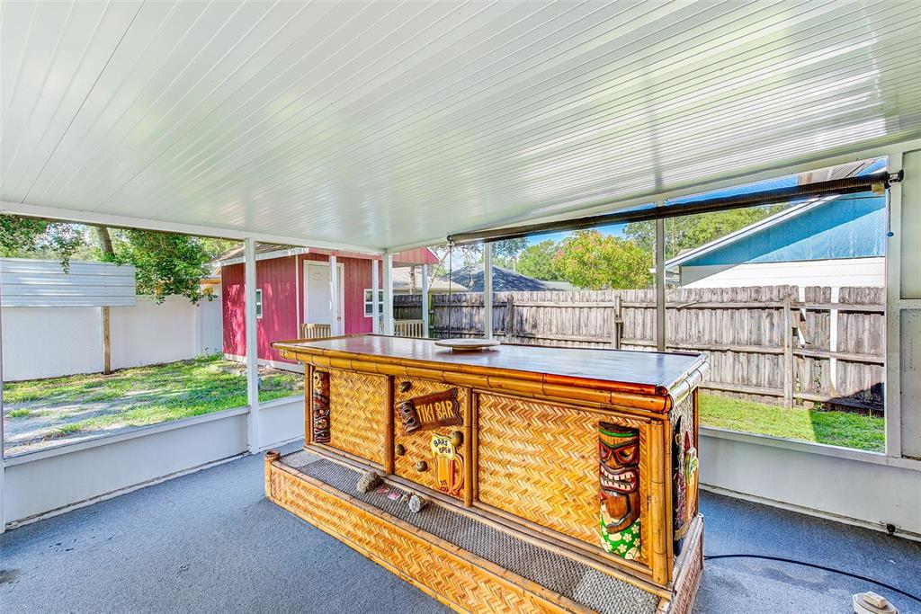 4707 East Temple Heights Road Tampa, FL 33617 - Photo 25 of 54 a view of a two chairs in the patio
