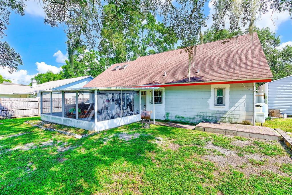 4707 East Temple Heights Road Tampa, FL 33617 - Photo 29 of 54 a view of a house with a yard and sitting area