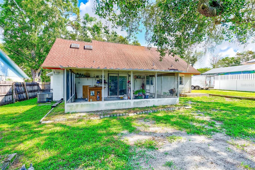 4707 East Temple Heights Road Tampa, FL 33617 - Photo 30 of 54 a view of a house with a yard and sitting area