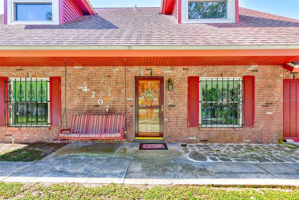 4707 East Temple Heights Road Tampa, FL 33617 - Photo 3 of 54 a front view of a house with a yard