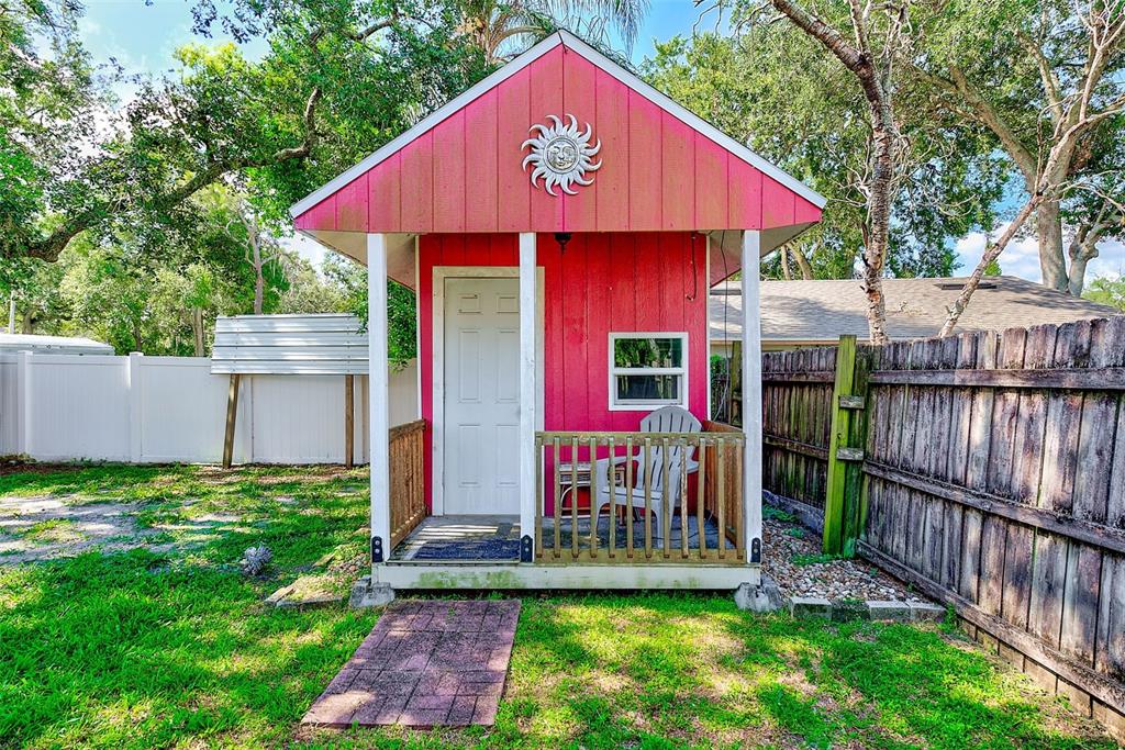 4707 East Temple Heights Road Tampa, FL 33617 - Photo 39 of 54 a view of a house with backyard porch and sitting area