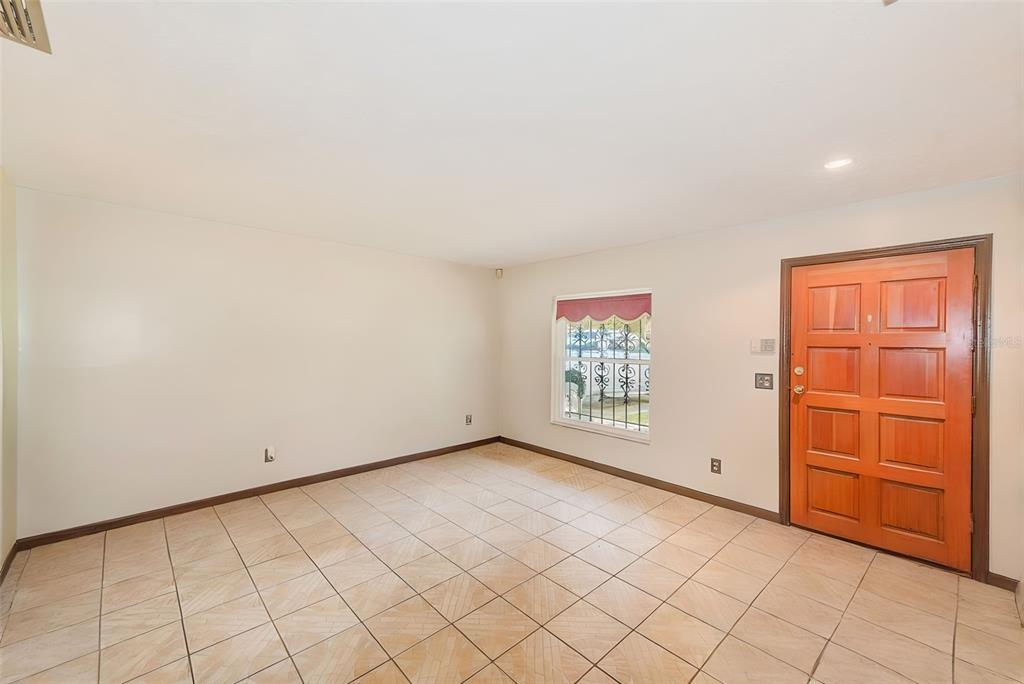 4707 East Temple Heights Road Tampa, FL 33617 - Photo 4 of 54 an empty room with windows