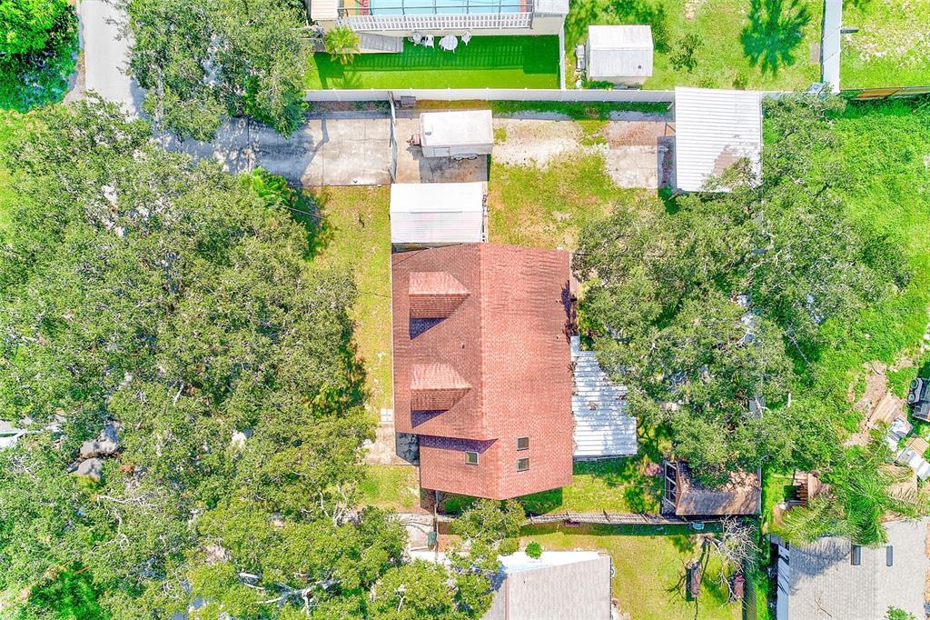 4707 East Temple Heights Road Tampa, FL 33617 - Photo 52 of 54 an aerial view of a house with a yard and lake view