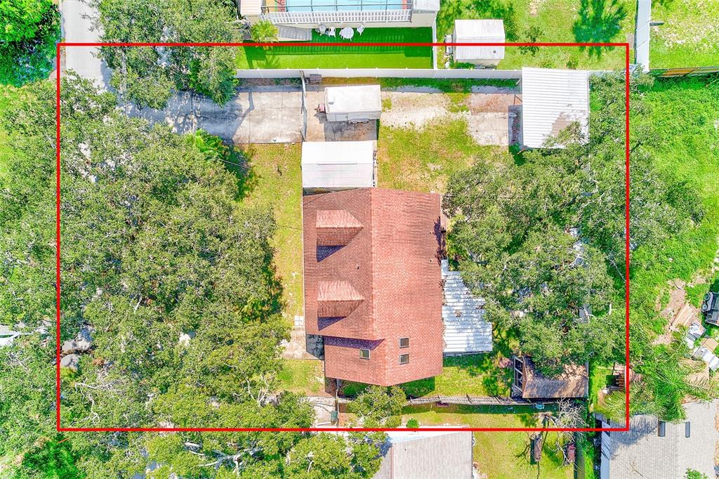 4707 East Temple Heights Road Tampa, FL 33617 - Photo 53 of 54 an aerial view of a house with a yard and lake view