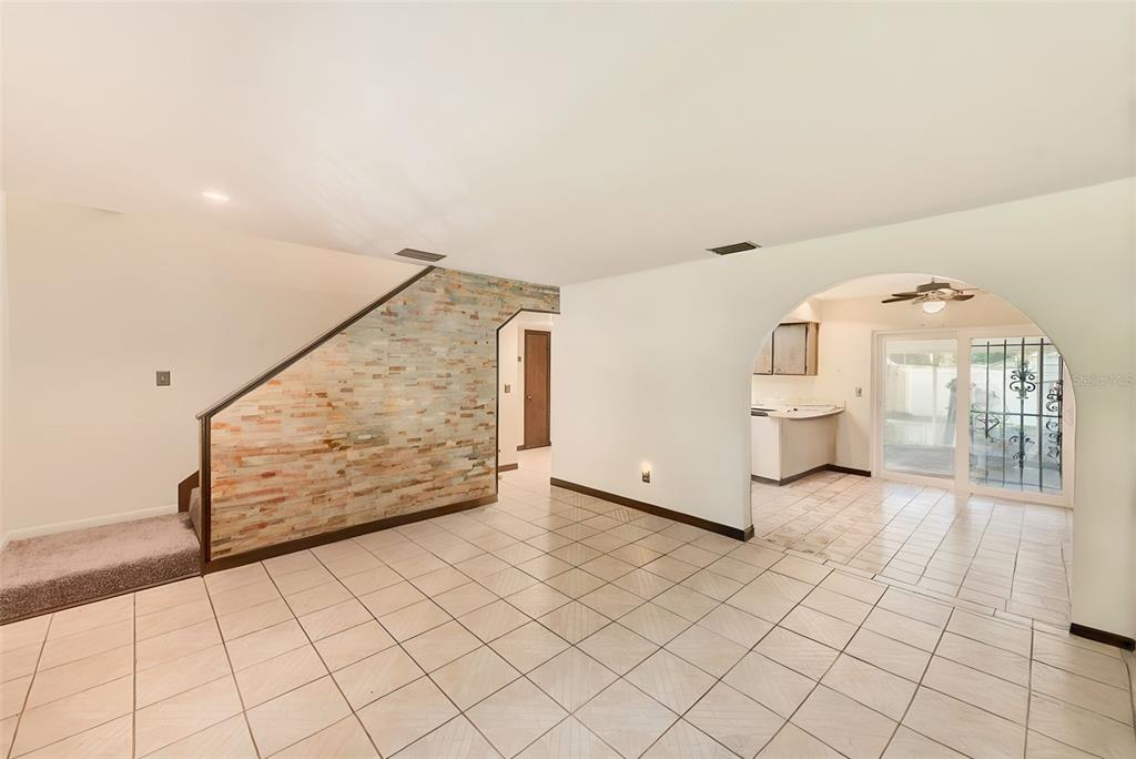4707 East Temple Heights Road Tampa, FL 33617 - Photo 6 of 54 a view of a living room and entryway