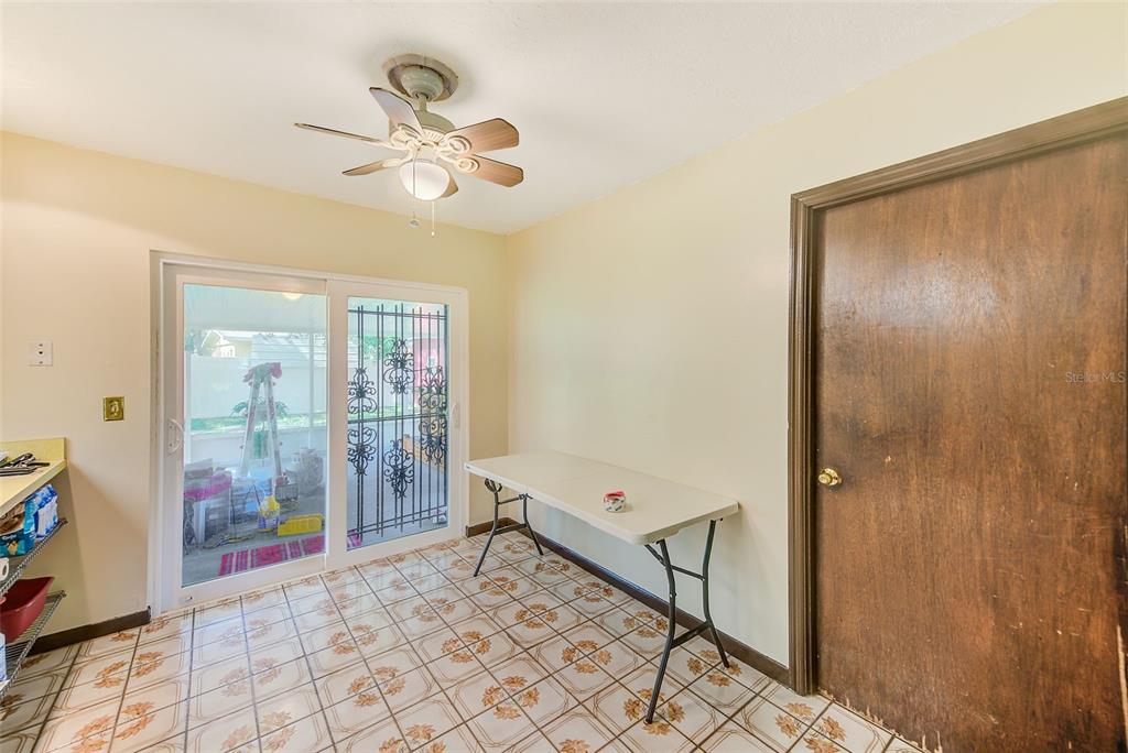 4707 East Temple Heights Road Tampa, FL 33617 - Photo 8 of 54 a view of an entryway with a chandelier