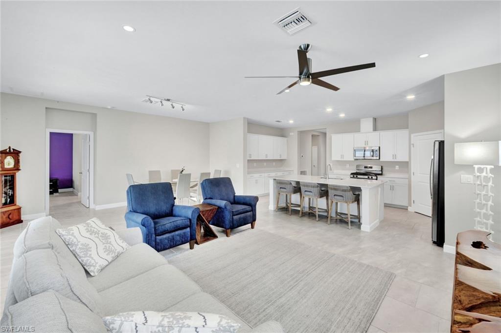 18298 Ridgeline Drive Estero, FL 33928 - Photo 12 of 49 Living area with a ceiling fan and recessed lighting