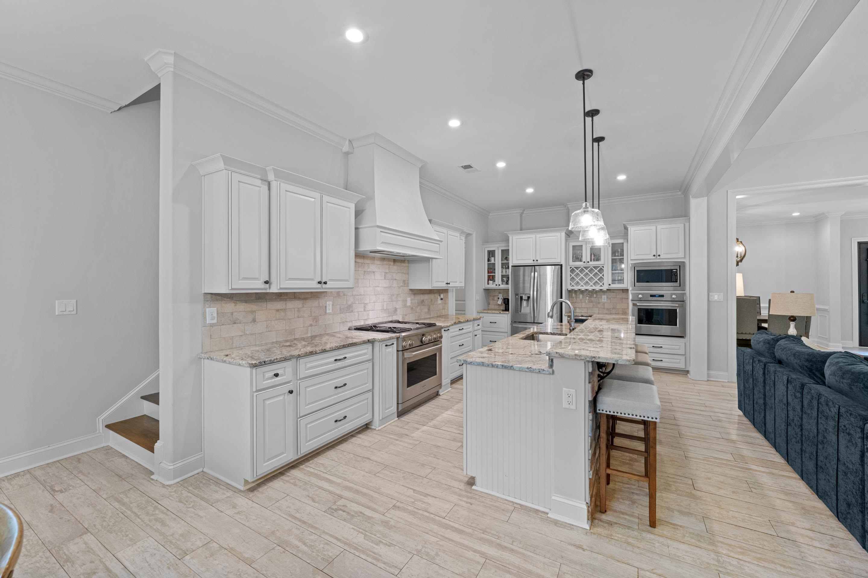 10354 Pleasant Ridge Road Arlington, TN 38002 - Photo 12 of 40 The open-concept design keeps everyone connected, whether hosting guests or enjoying a quiet night at home. The oversized island anchors the heart of the home beautifully.